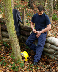 Englishlads.com: Fireman Chris unloads in the woods, helmet to helmet...
